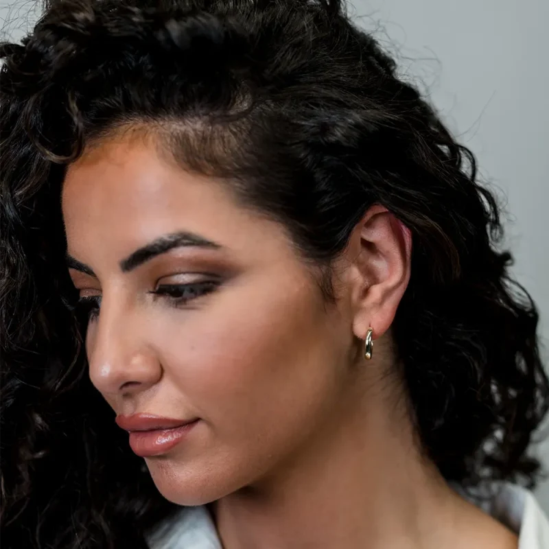 The Kiss: Gold Medium Sized Hoop Earrings - Image 2